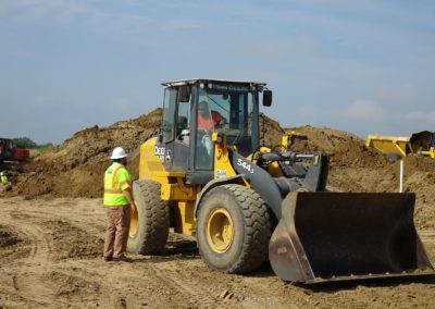 safety forman talking to loader driver