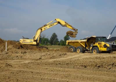 backhoe loading dump truck