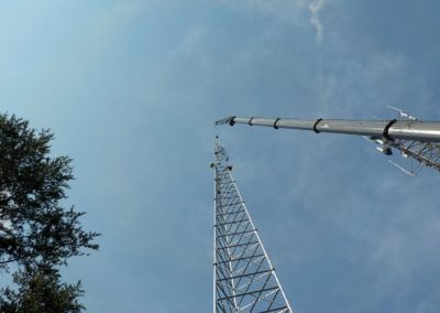 Crane hoisting Cell tower